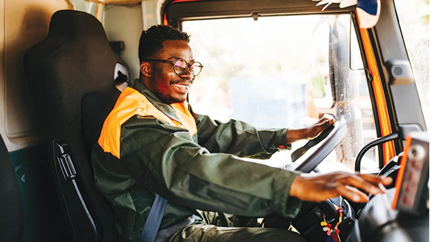 Person sitting in cab of truck