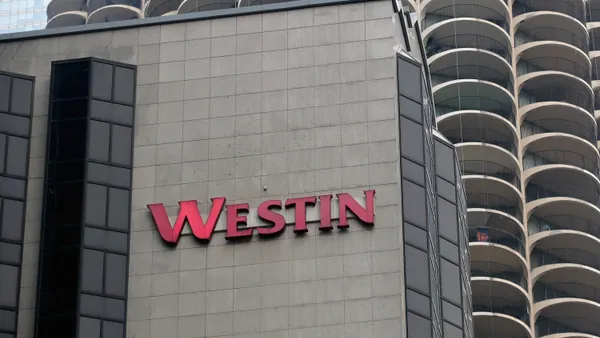 A Westin hotel logo on the outside of the building.