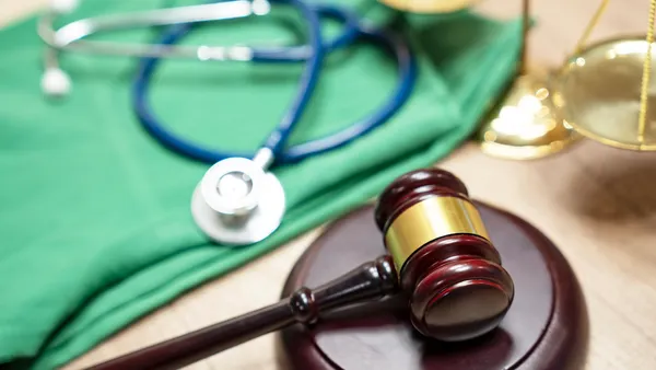 Gavel and stethoscope. medical jurisprudence. legal definition of medical malpractice. attorney. common errors doctors, nurses and hospitals make