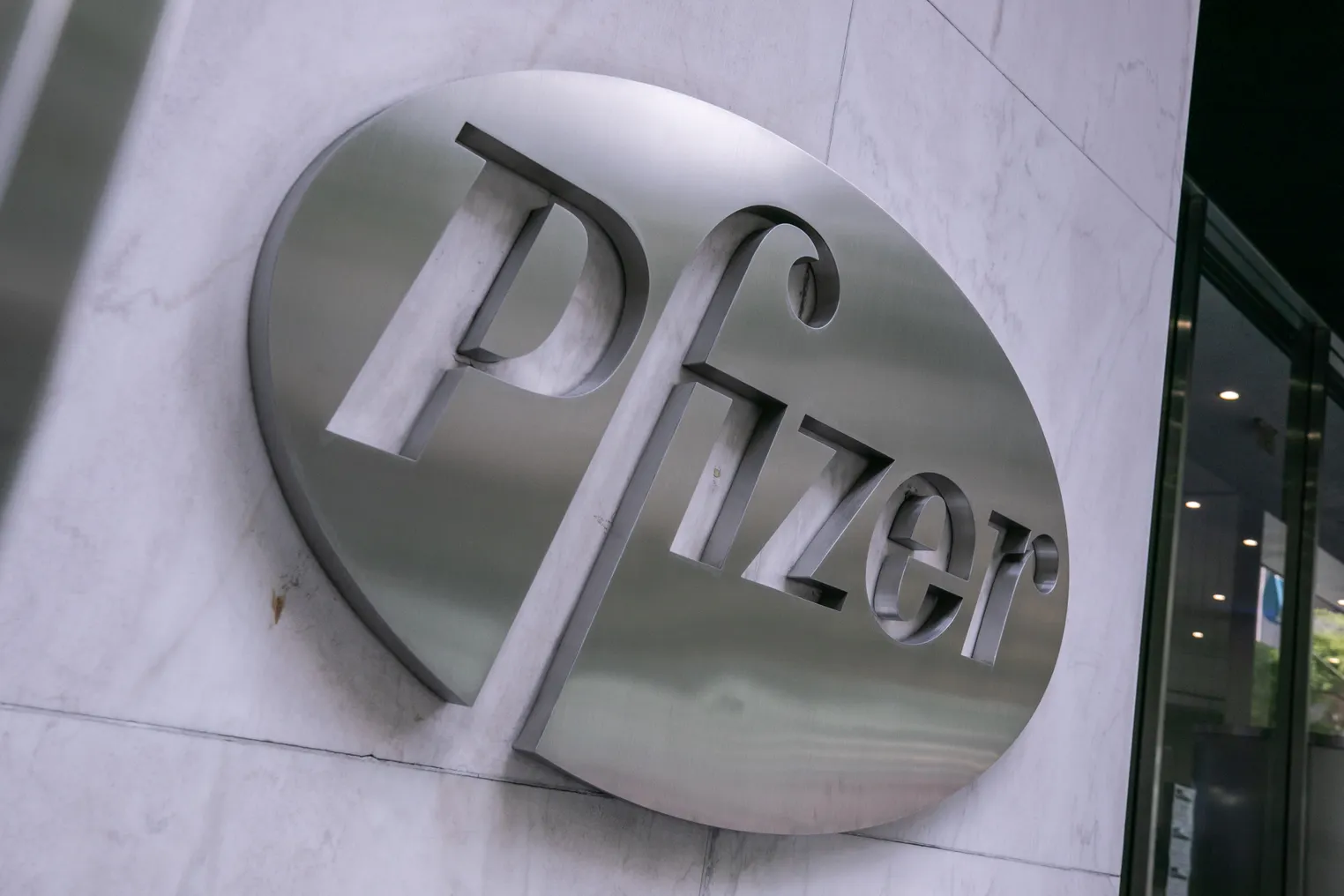 Pfizer's logo cast in metal.