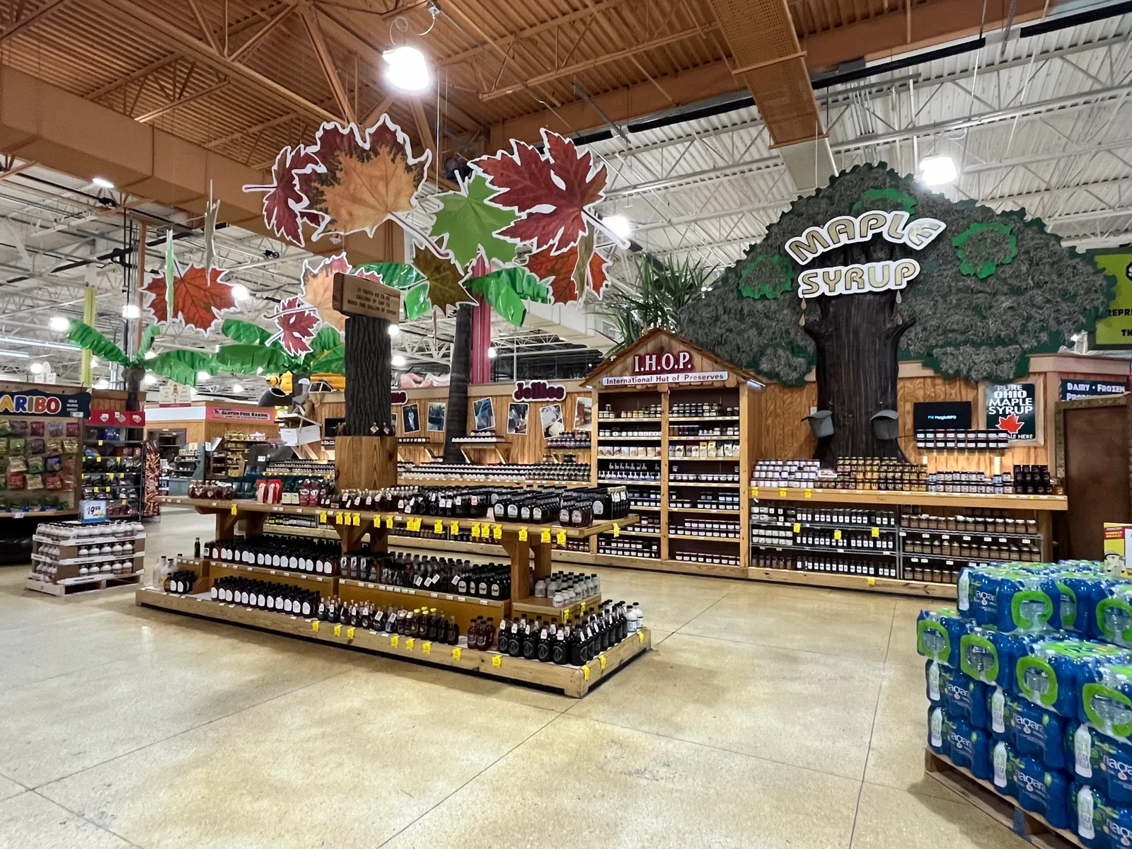 Maple syrup displays at a grocery store.