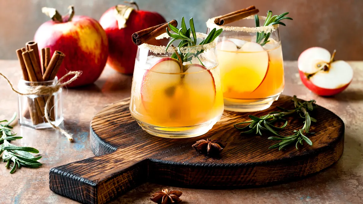 Smoky apple cider margarita fall cocktail with cinnamon, rosemary and star anise