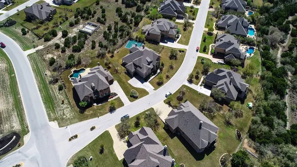 Suburb in Dripping Springs , Texas , USA aerial drone view above homes and houses in neighborhood