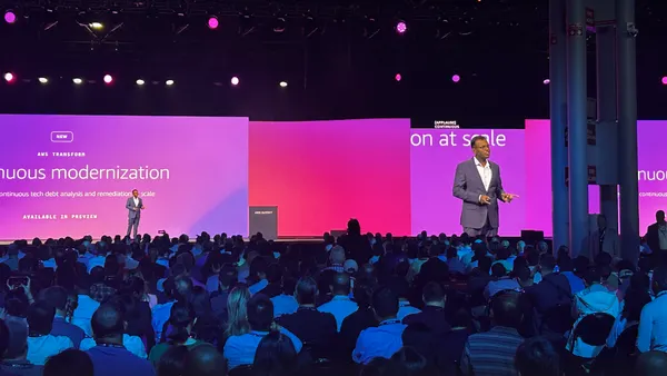 an executive speaks on stage