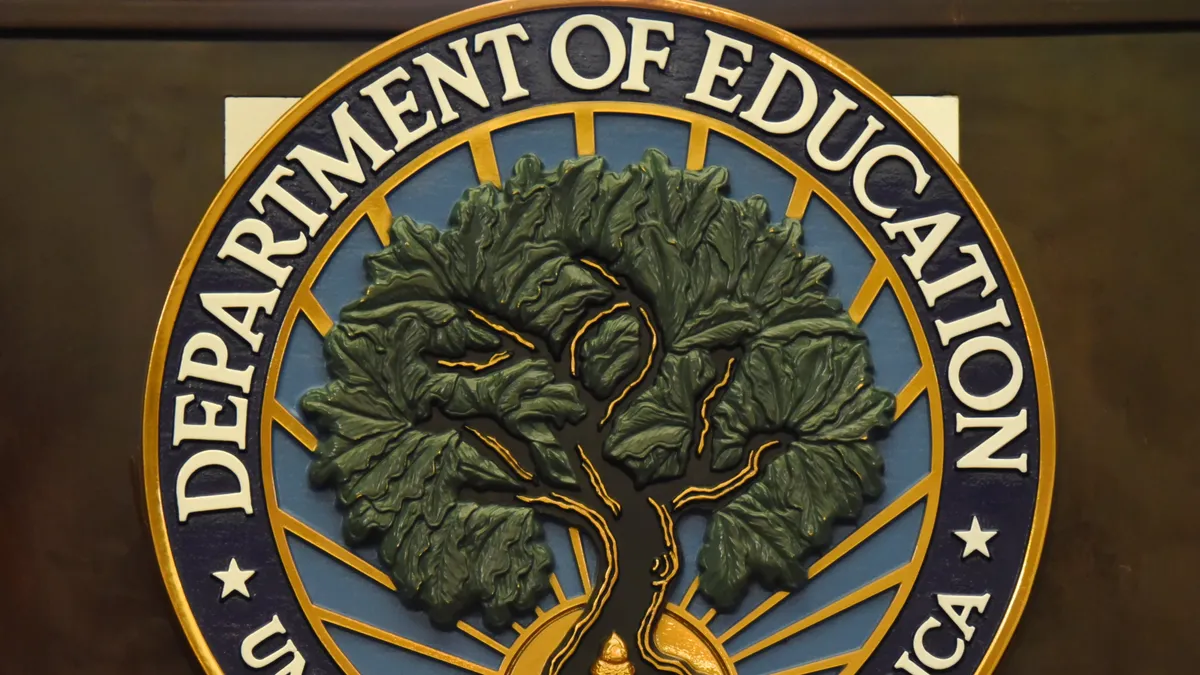 A close up of Education Department logo.