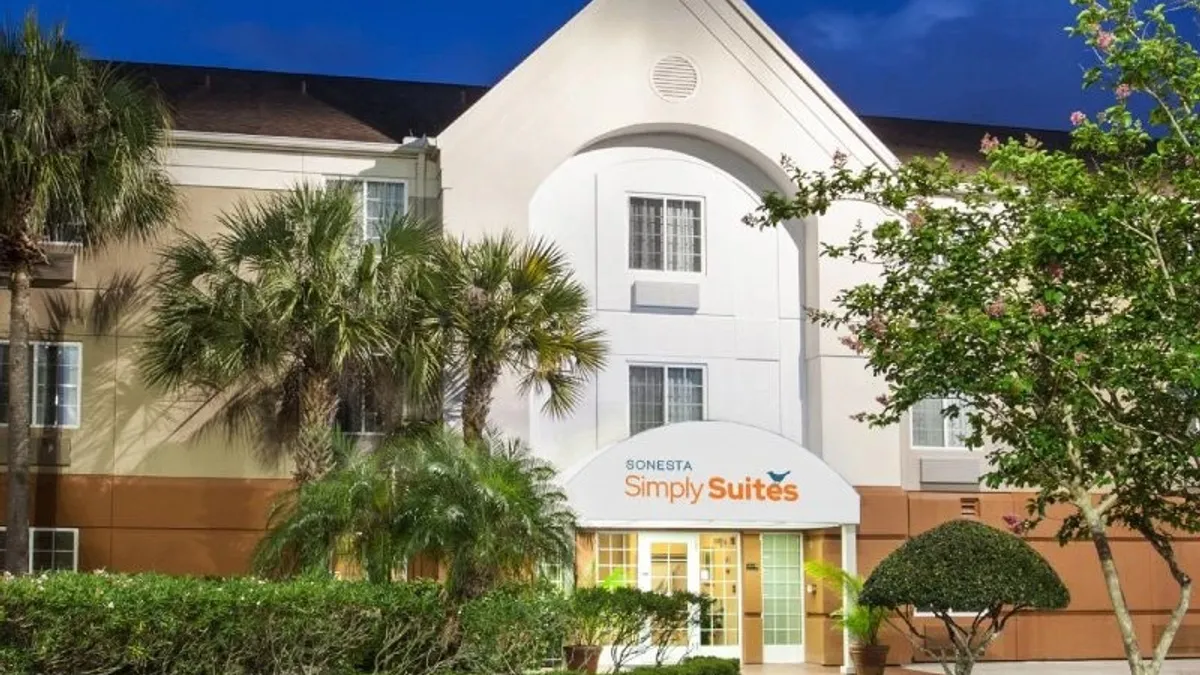 An exterior view of a Simply Suites extended stay hotel from Sonesta