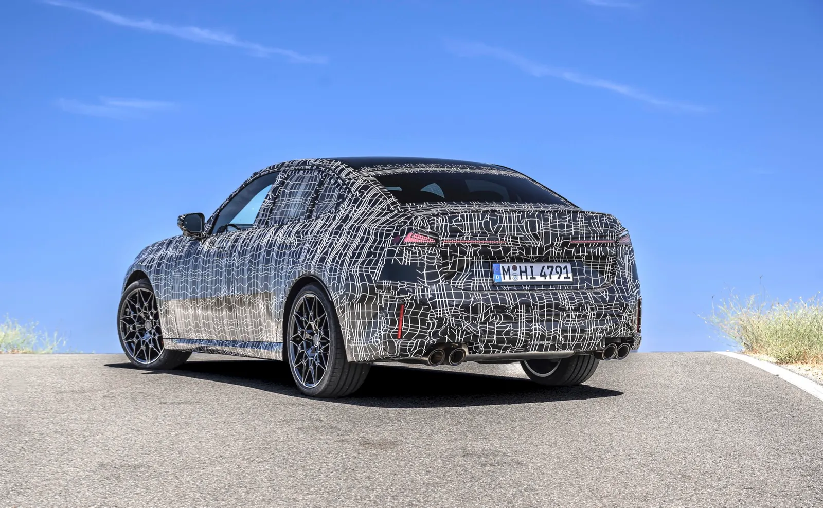 The 2027 BMW 3-Series, in camouflaged prototype form.