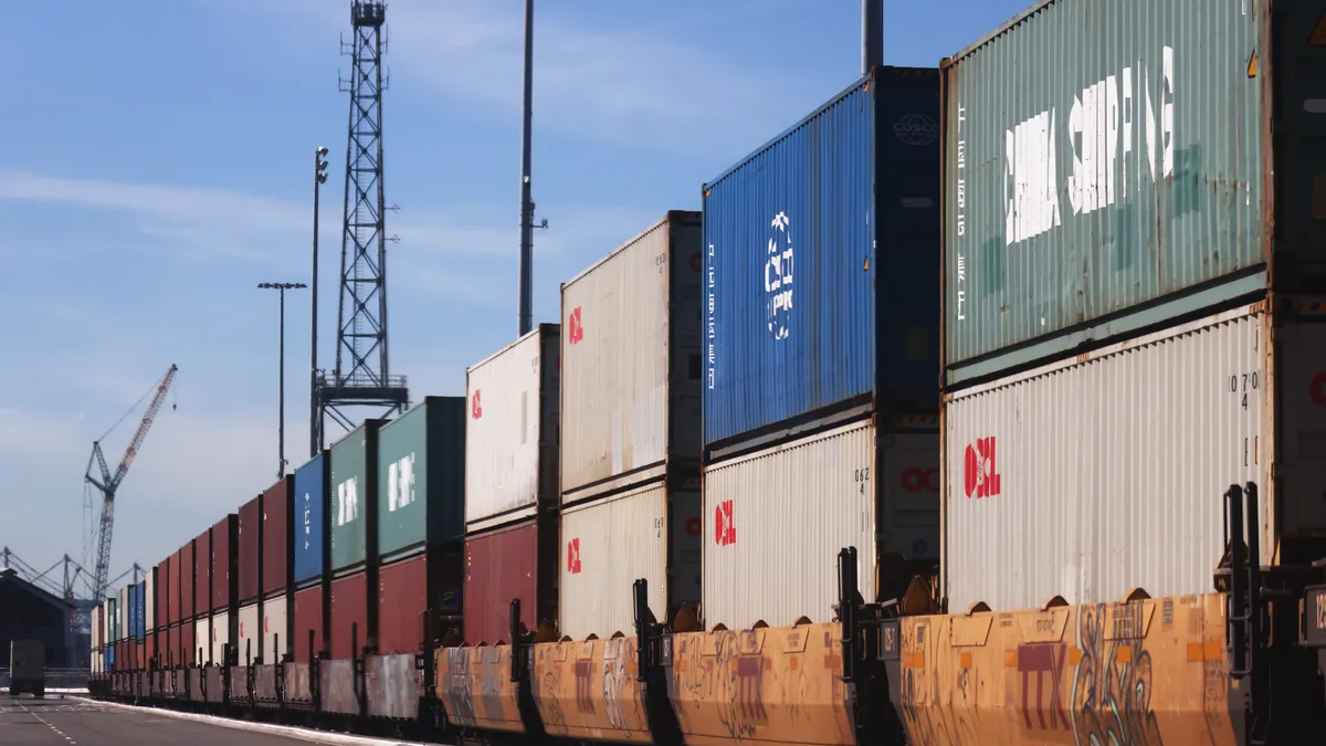 Shipping containers sit on train cars at the Port of Long Beach.