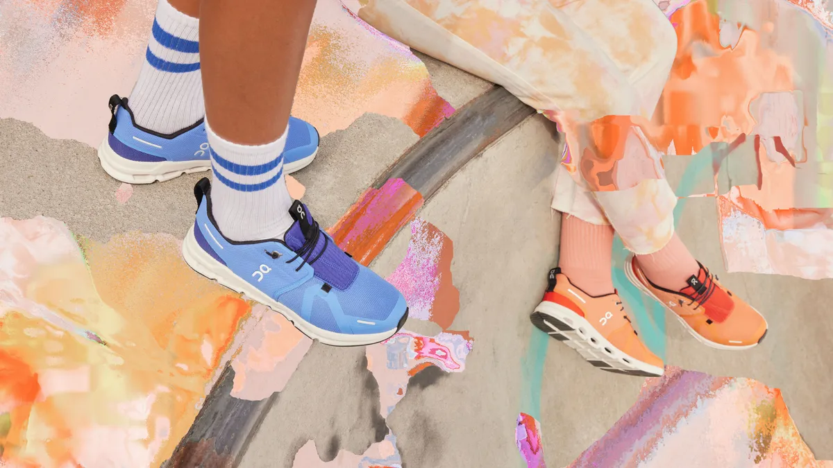 Two sets of feet on an overhand wear bright peach and blue sneakers