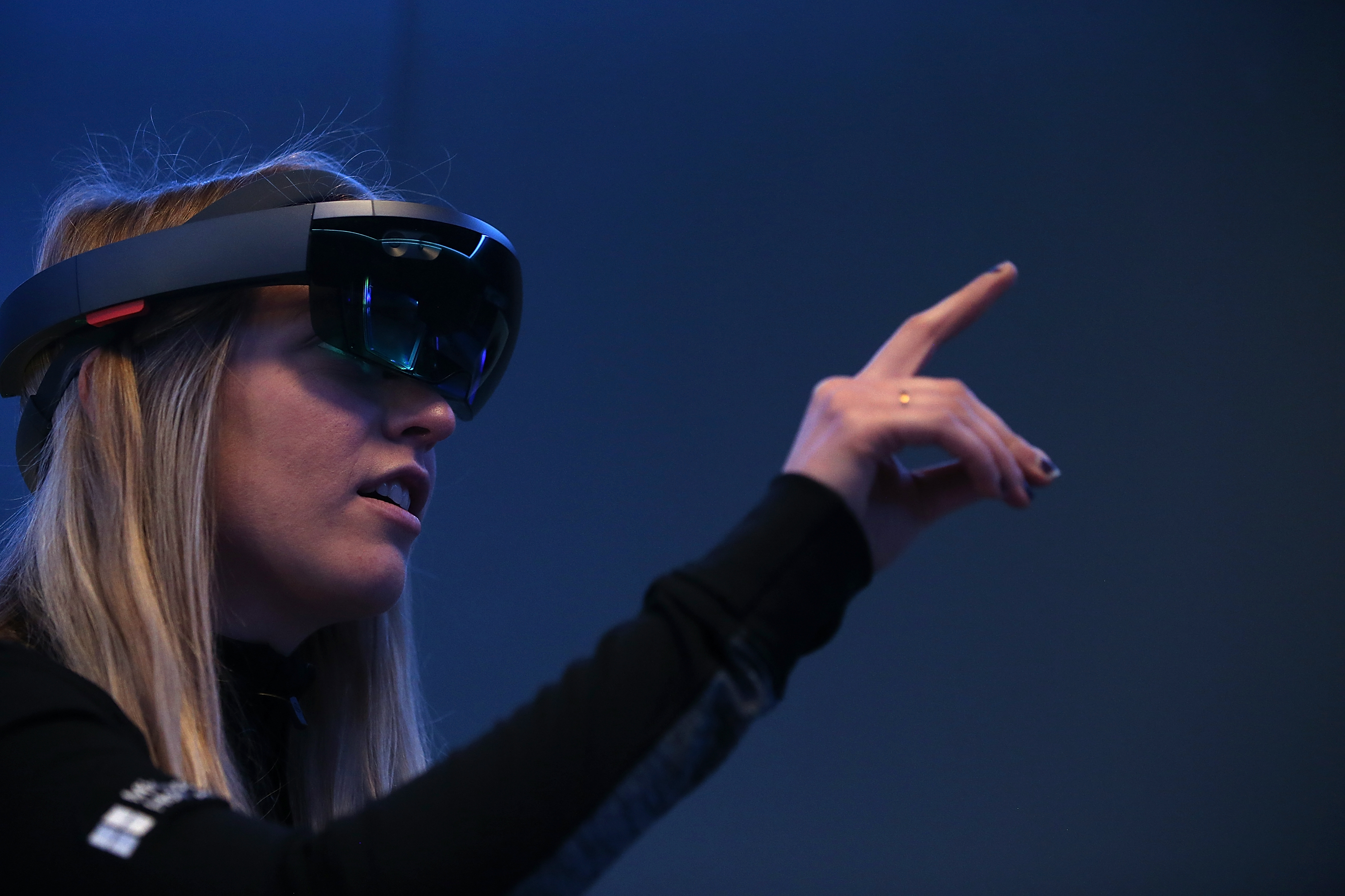 Microsoft employee Gillian Pennington demonstrates the Microsoft HoloLens augmented reality (AR) viewer during the 2016 Microsoft Build Developer Conference on March 30, 2016 in San Francisco.