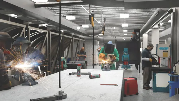 Three people at a white table wearing shields as they weld metal.