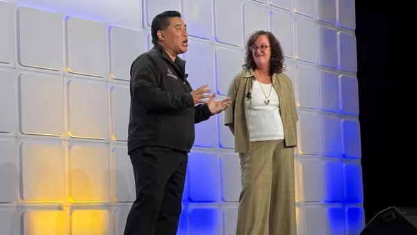 a man and a woman present on stage