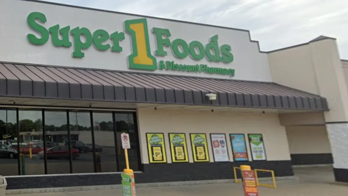 Exterior of a supermarket with a sign that reads "Super 1 Foods & Discount Pharmacy"