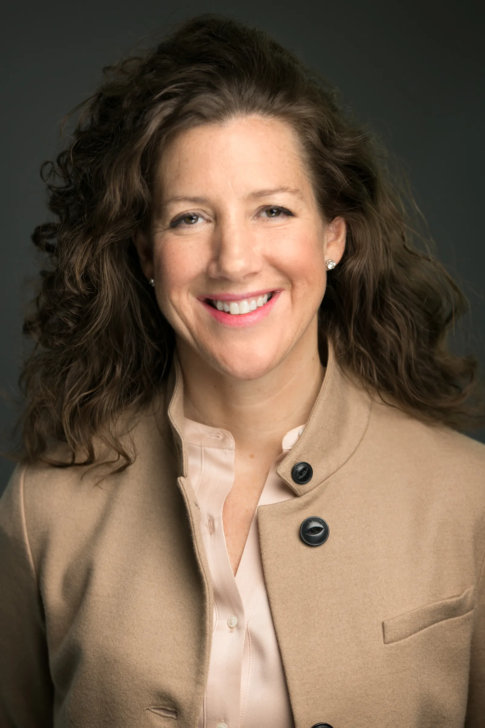 A headshot of KFC executive Catherine Tan-Gillespie wearing a tan top