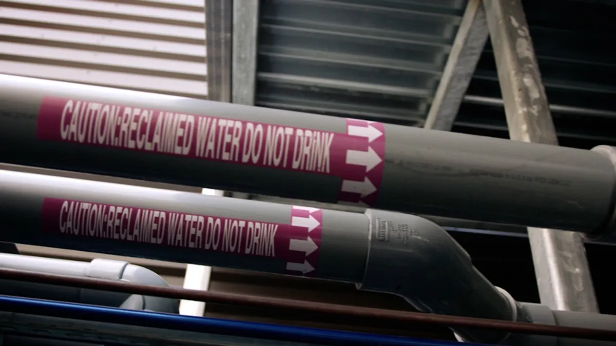 An image of two pipes that say "Caution: Reclaimed Water Do Not Drink"