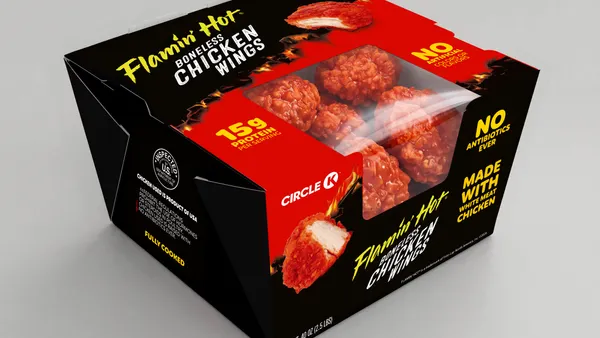 A box with branding for Flamin' Hot wings and a transparent window showing chicken wings inside.