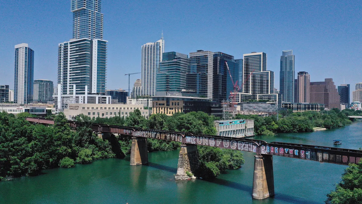 The Austin, Texas, skyline is shown against a bright blue sky in May 2020.