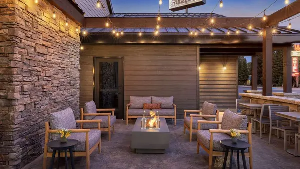 Chairs around a fire pit.