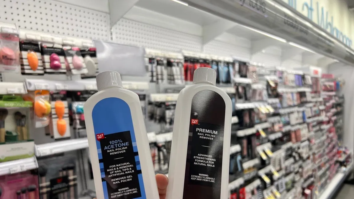 Two bottles of Walgreens brand nail polish remover with different colored labels.