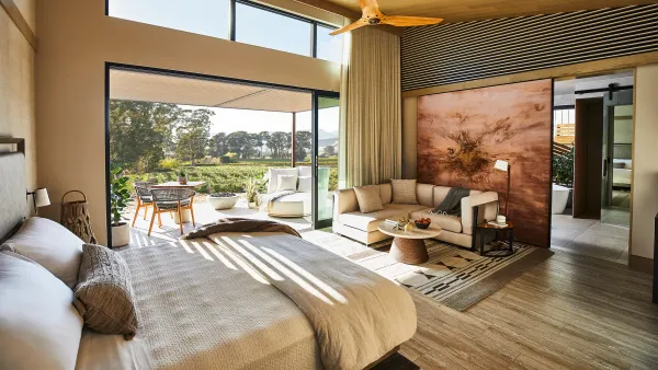 Inside of a guest room with a private balcony