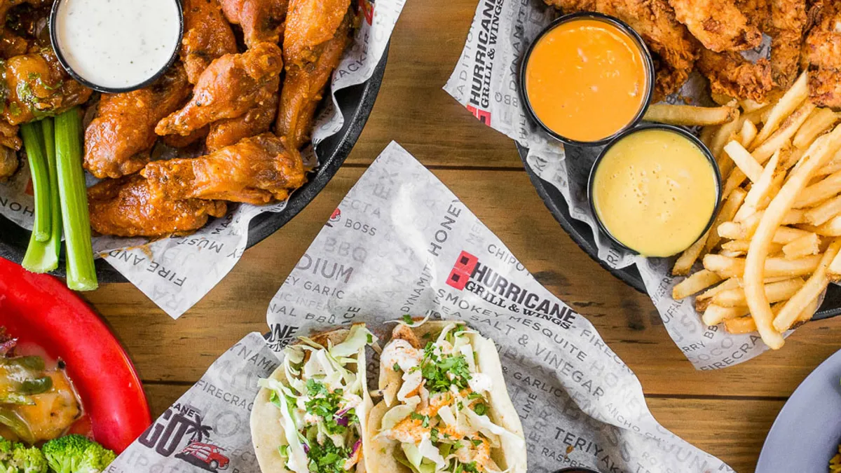 An image of chicken wings, tacos, French fries and chicken tenders from Hurricane Grill & Wings