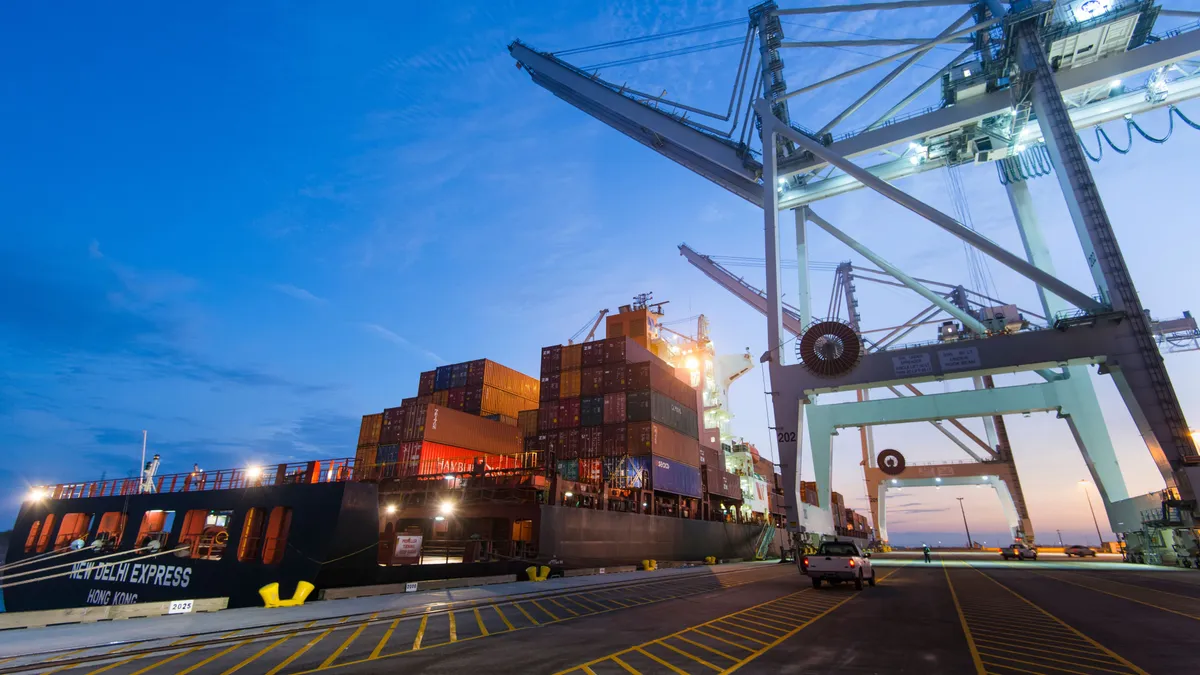 A container vessel docked at a ocean terminal.