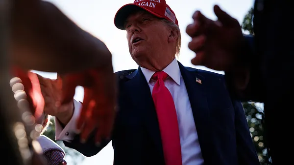 U.S. President Donald Trump greets guests after delivering remarks during a military family picnic on the South Lawn of the White House on July 4, 2025.