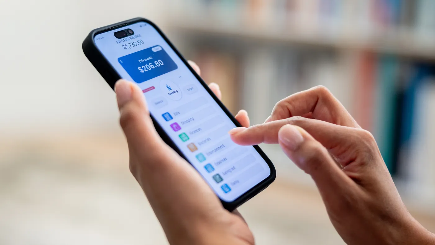 Close-up of person using bank app on mobile phone