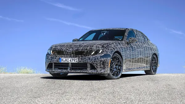 The 2027 BMW 3-Series, in camouflaged prototype form.