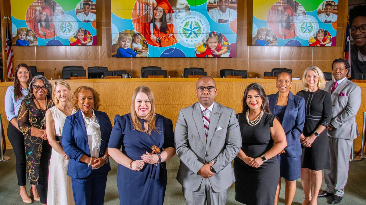 Current Houston ISD district leaders stand in a board room