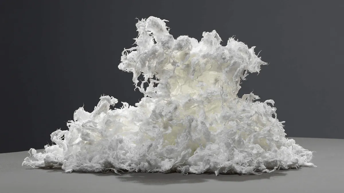 A pile of pulp from textile recycling firm Renewcell sits against a dark background.