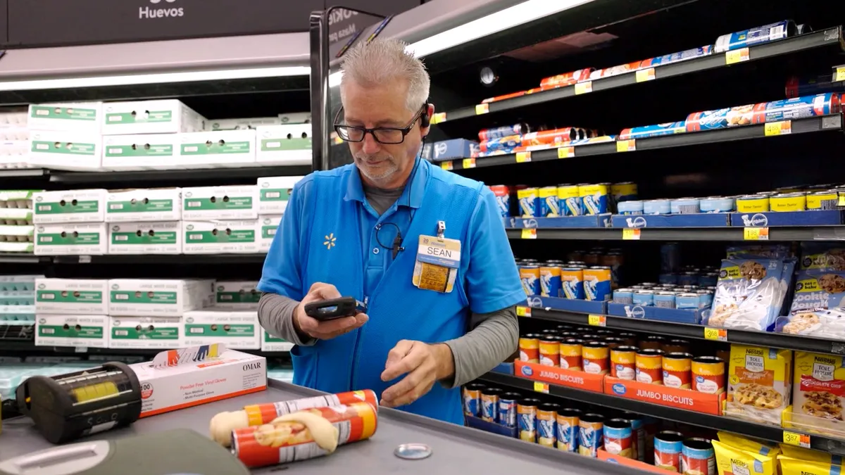 A worker using food waste reduction technology.