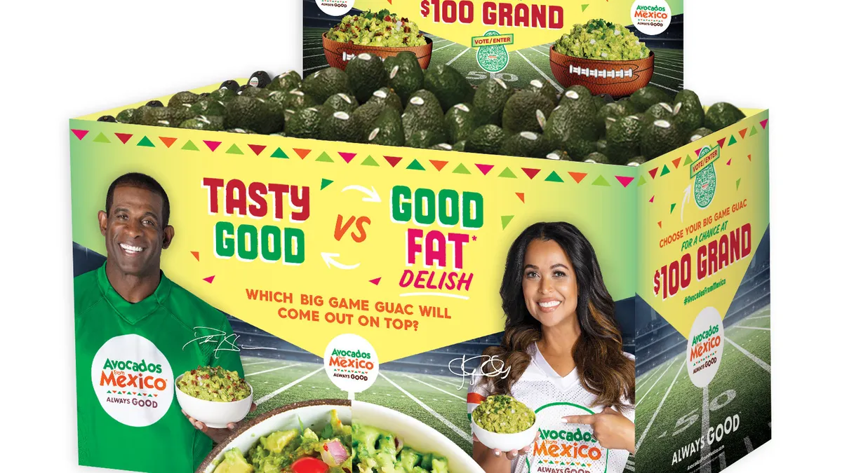 An Avocados from Mexico store display filled with produce is printed with the likenesses of Deion Sanders and Tracey Edmonds.