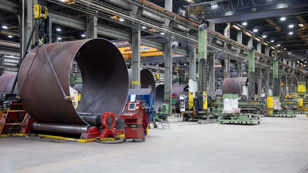 Wind turbine towers sit under construction at CS Wind