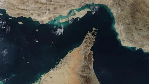 The Strait of Hormuz shown by a satellite image in 2020, with the Persian Gulf and Gulf of Oman on each side.