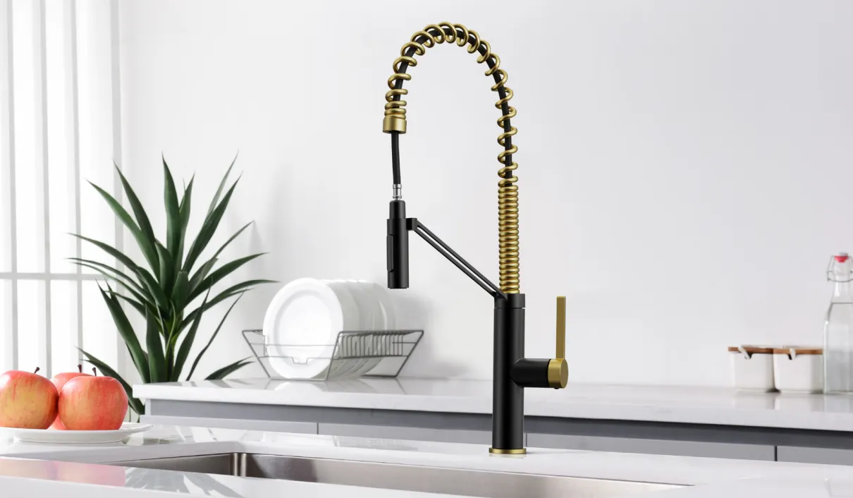 A kitchen faucet with a gold spiral spout.