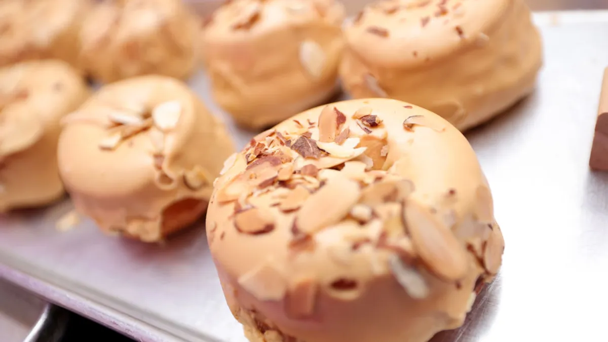 Doughnuts are displayed on a tray.