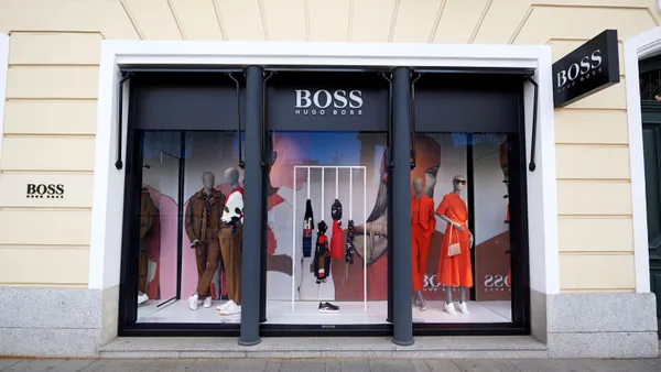 A Hugo Boss clothing store as seen from the outside on a sunny day.