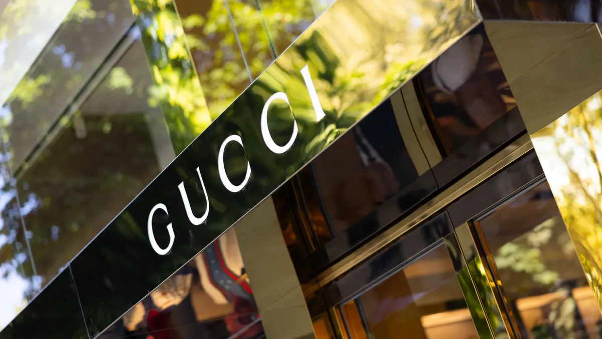 The goldtone front of Italian luxury fashion house store Gucci is pictured from the outside.