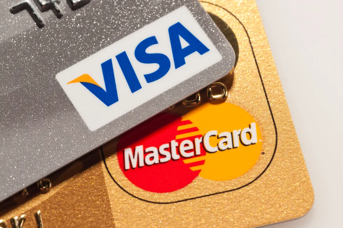 Visa, Mastercard cite travel slowdown impact