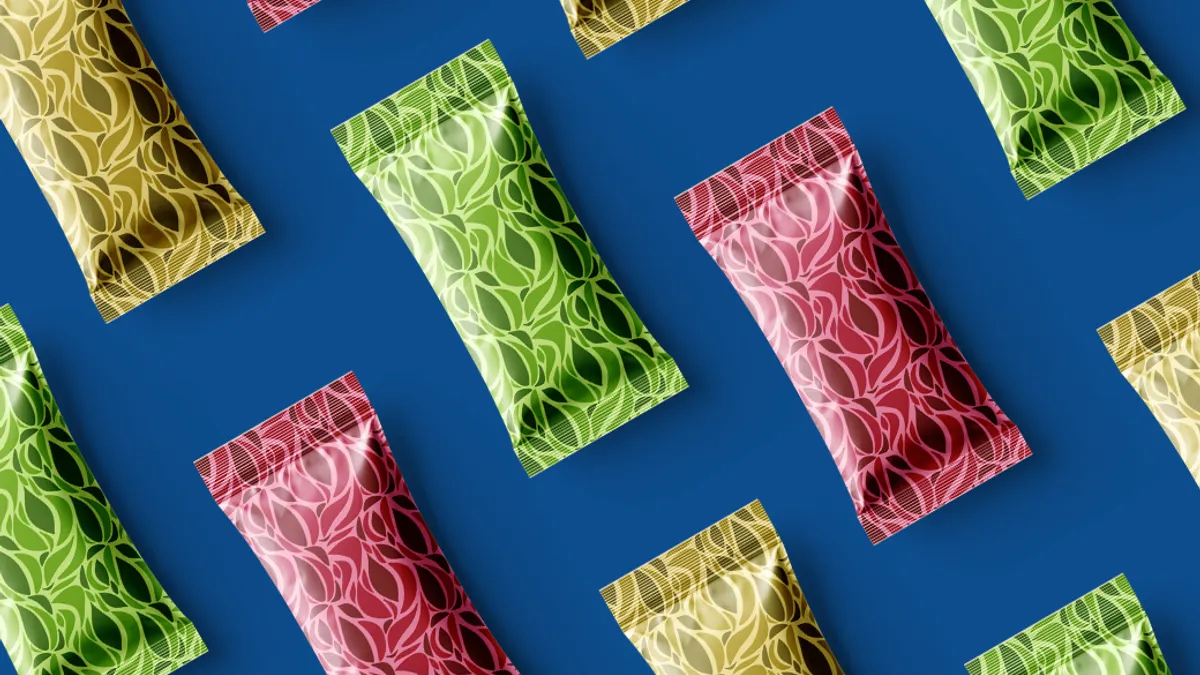 Colorful patterned wrappers arranged diagonally on a blue background.