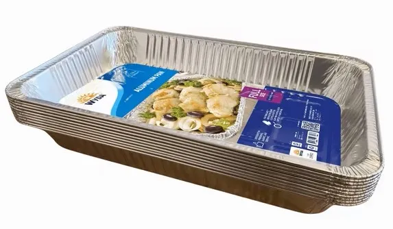 An aluminum pan used for food has a label affixed to the inside.