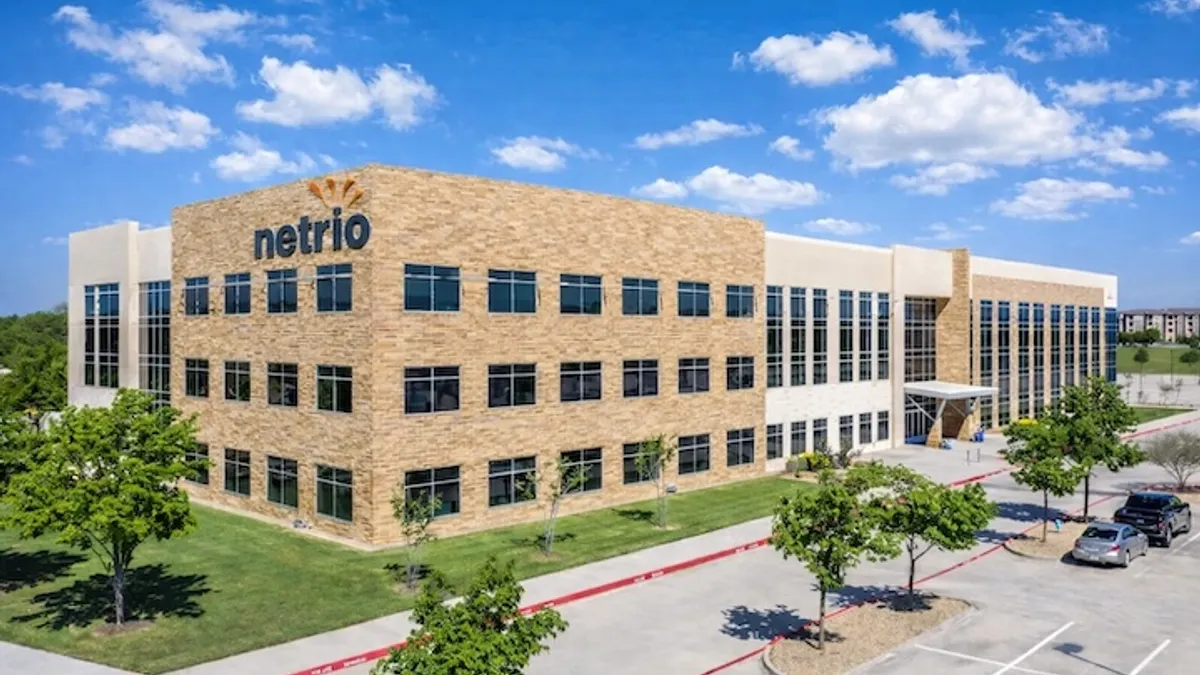 A large building with the corporate logo for the managed service provider netrio visible.
