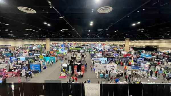 An overhead view of an expo hall floor at a conference.