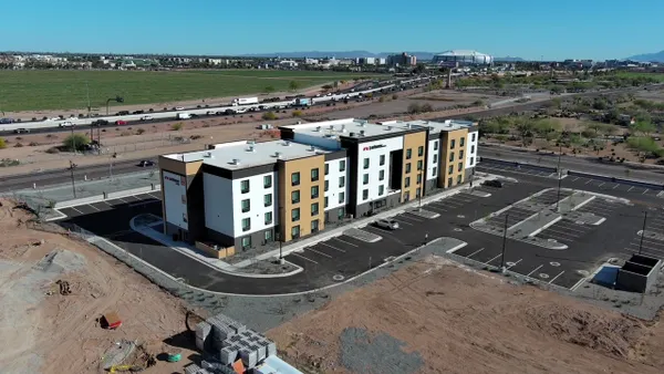 Hotel near a parking lot and highways