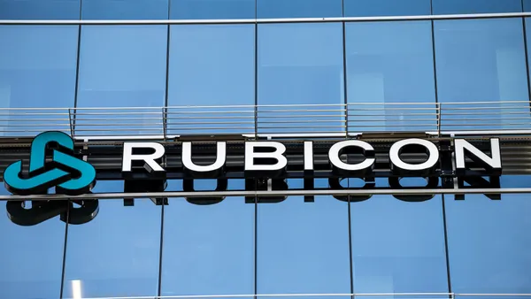 Exterior of glass-walled office building with letters spelling "Rubicon"