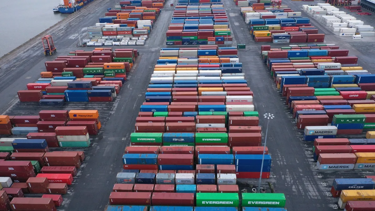 Shipping containers are stacked on the dockside at The Port of Liverpool on December 10, 2020