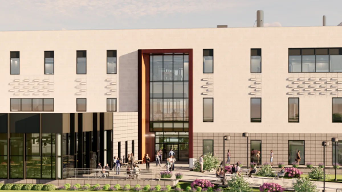 A rendering depicts the design of a three-story Engineering Classroom and Research Building.