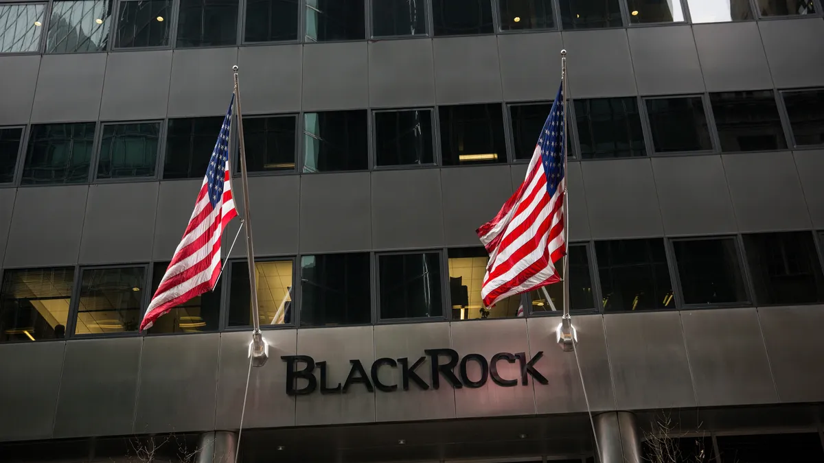 Flags fly above the entrance of the BlackRock offices.