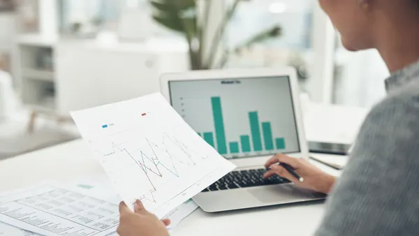 businesswoman analysing graphs in an office